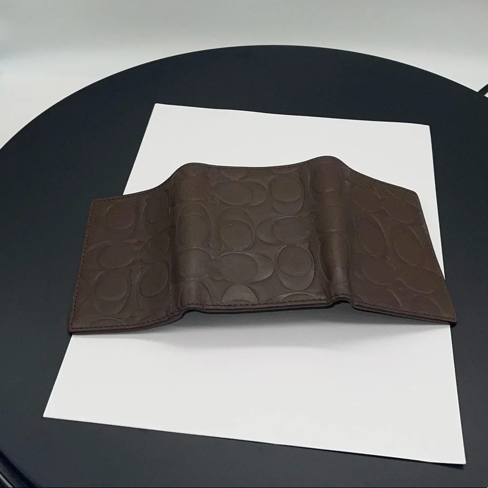Coach Signature Embossed Trifold Wallet